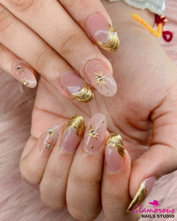 This look is all about luxury. We used a soft, translucent base to create a canvas for these stunning 3D gold swirls and celestial starbursts, each accented with tiny rhinestones. It’s a high-fashion, glamorous set perfect for making a statement.