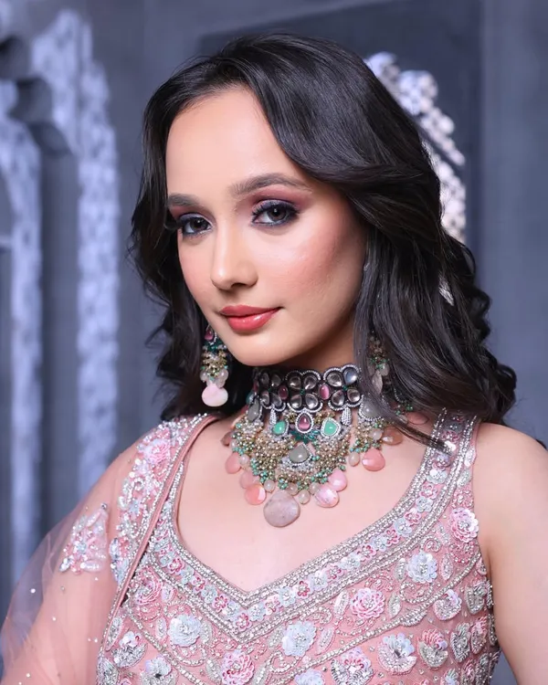 Elevating bridal beauty to new heights. This is the quality of work you will produce. This look features a dramatic smokey eye and soft waves, perfect for a modern, fashion-forward bride.