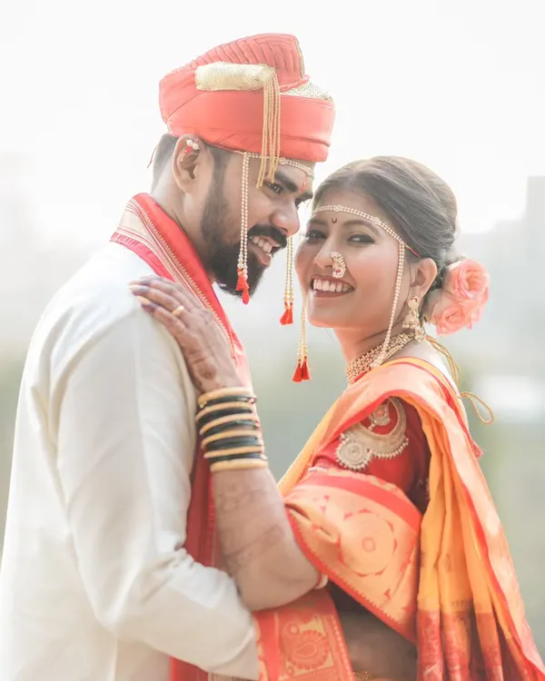 A joyful, candid portrait of Pratik and Madhuri. Her smile as he looks at her captures the real happiness of their wedding day. These are the unposed moments we strive to photograph.