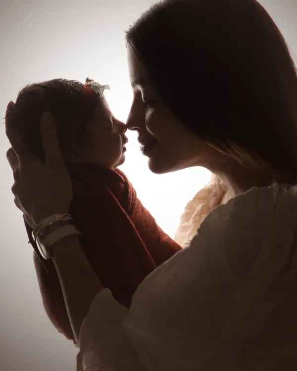 This is the kind of magic I love to capture. A quiet moment between a mother and her newborn, captured in a timeless silhouette that highlights their immediate, unbreakable bond.