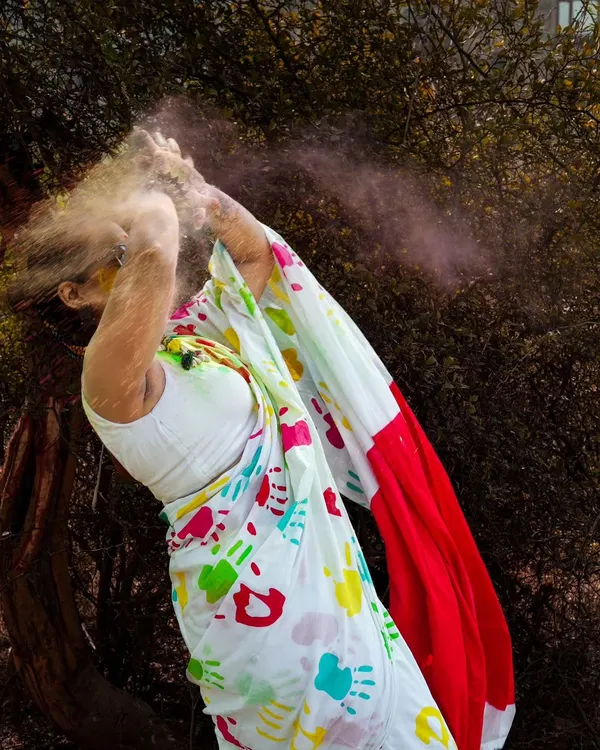 The pure joy of Holi captured in a burst of color. Action shots like this are the heart of a themed shoot, creating dynamic and unforgettable images that are full of life and energy.