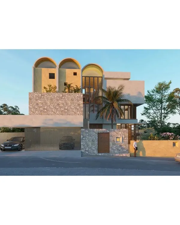 This rendering shows the full exterior concept. The design grounds itself with heavy stone walls and a solid base, while the upper floors feature lighter, vaulted forms that give the home its unique contemporary-vernacular character.