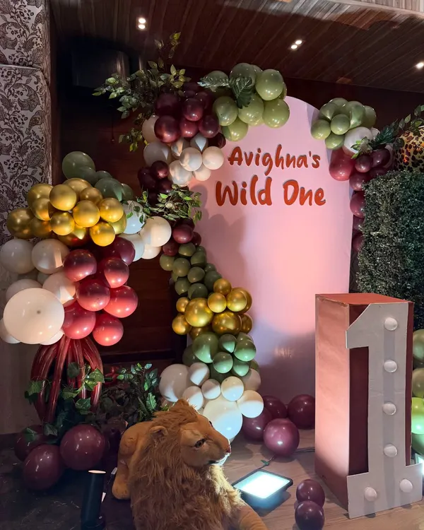 A 'Wild One' first birthday party comes to life with a custom backdrop, themed balloon garlands, and safari animal props. We specialize in bringing popular kids' party themes to life with creative and detailed setups.