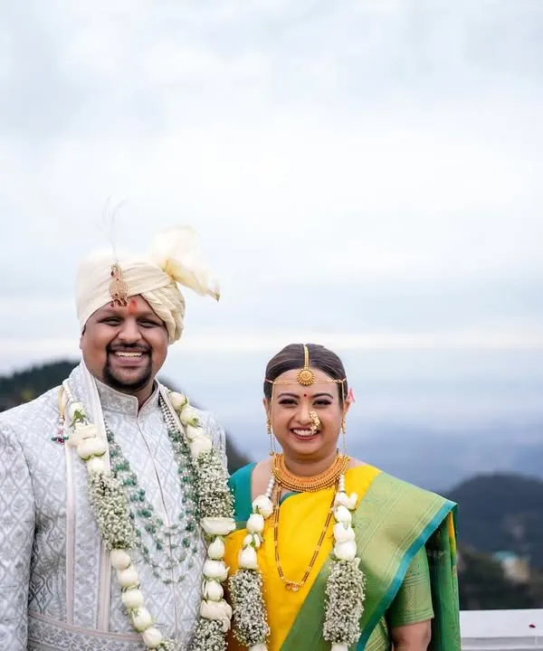 A majestic portrait of the couple against the backdrop of the Mussoorie hills. This is what destination wedding photography is all about.
