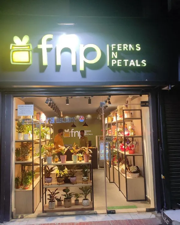 The completed storefront for a Ferns N Petals (FnP) outlet we designed. We created a clean, modern facade with prominent, backlit branding to attract foot traffic and clearly communicate the brand.