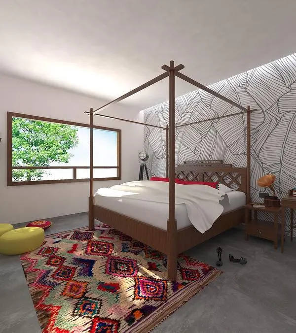 This master bedroom concept was designed for a couple who wanted a space reflecting Indian ethnicity without fancy materials. The room features a classic four poster bed, concrete flooring, and a tropical-themed wall illustration, creating a bohemian and personal sanctuary.