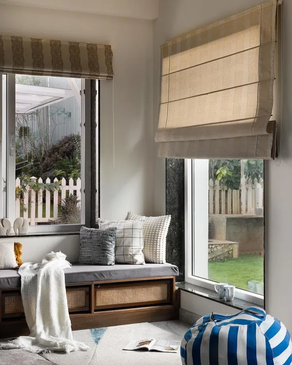 This cozy window seat is the perfect reading nook. I designed it with built-in storage underneath, featuring cane webbing for texture. It’s a simple addition that provides extra seating and a quiet corner to unwind.