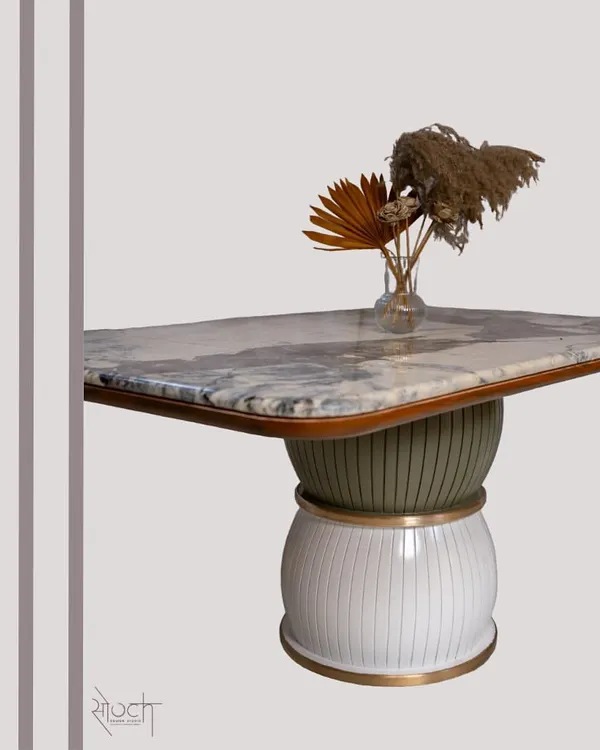 The "Damru" dining table, inspired by the musical instrument, stands on two spheres with a stunning Brazilian Quartzite top. This piece is a perfect example of how I blend cultural inspiration with modern design to create functional art.