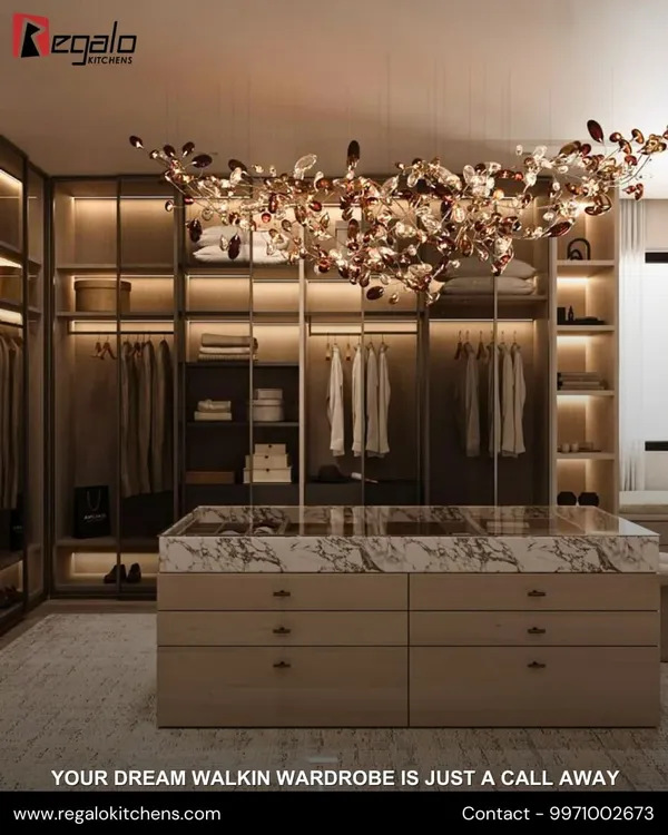 A masterpiece of design, this walk-in closet features a marble-topped central island and a stunning chandelier, blending opulent style with practical drawer storage for a truly luxurious feel.