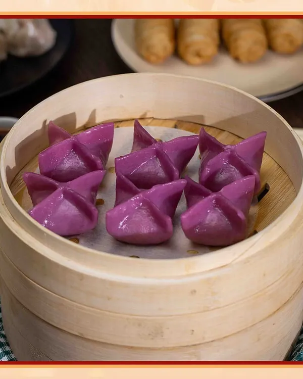 These vibrant purple star-shaped dumplings are as delicious as they are beautiful. Steamed to perfection in a traditional bamboo basket, they are a unique and flavorful part of our dim sum selection.