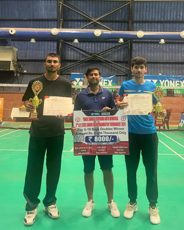 I stand with my winning trainees, Ujjwal Tomar and his partner, celebrating their double gold medal performance in Boy's Doubles and Mixed Doubles at the UP State Under 19 tournament in Prayagraj.