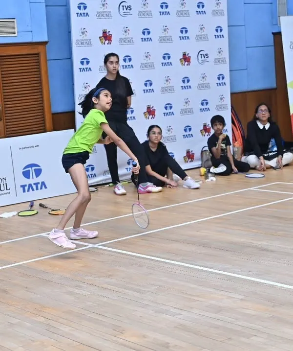 A young girl executes a forehand shot during our Intra-Academy Tournament at MCA, BKC. These internal tournaments provide crucial match practice in a supportive environment.