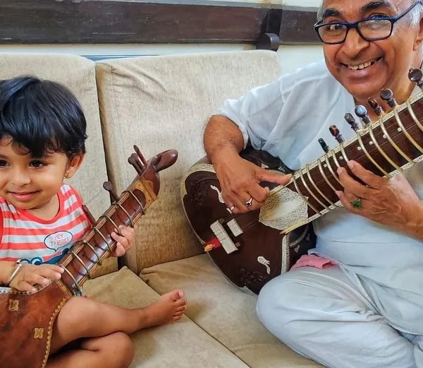My Baba, my first Guru, sharing his love for the sitar with my young nephew. This is how the journey begins, with curiosity and gentle guidance, and I welcome students as young as six to start their own musical path.
