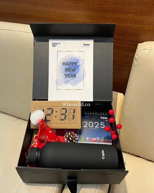 Kicking off the New Year with a stylish gift for Cipla employees. This hamper includes a branded bottle, a 2025 calendar, a digital clock, and festive decorations.