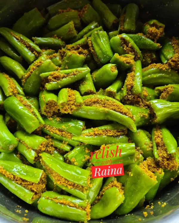 This is a close-up of my Stuffed Green Chilli Pickle before the oil is added. You can see how each chilli is carefully slit and filled with a freshly ground masala mix of mustard, fennel, and other spices.