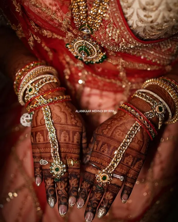 This is the result of my organic henna. A stunningly dark stain, beautifully accessorized with bridal jewelry, showcasing the richness of the color.