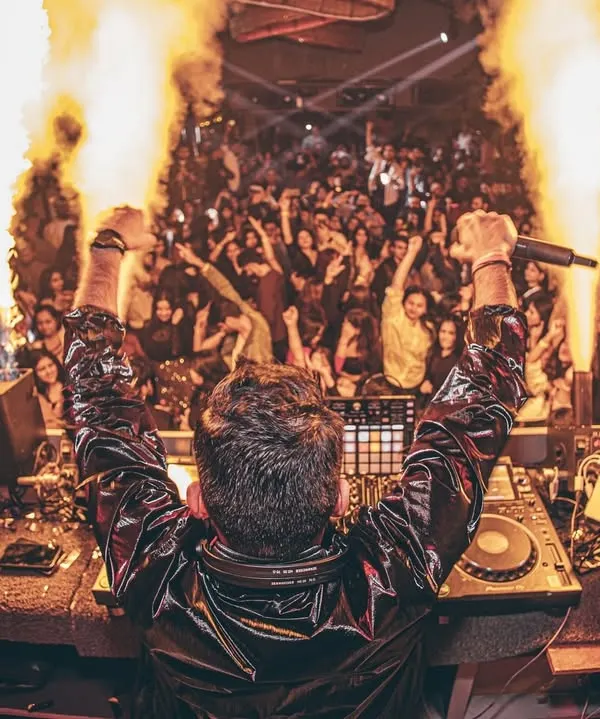 This is the moment I live for. Standing before a sea of people, feeling the energy build, and knowing we're about to create a memory together. This is more than just a party; it's a full-blown audio-visual experience.