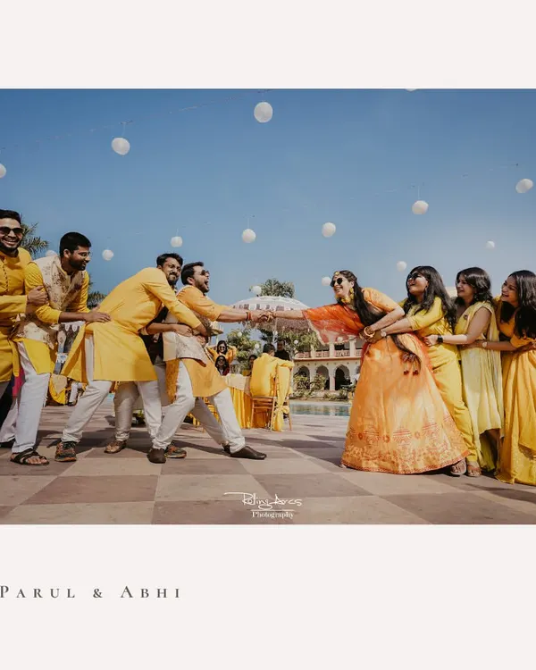 The ultimate battle of the sexes. This fun-filled tug of war between the bride's and groom's sides is a perfect example of the candid, chaotic joy I love to capture at Haldi ceremonies.