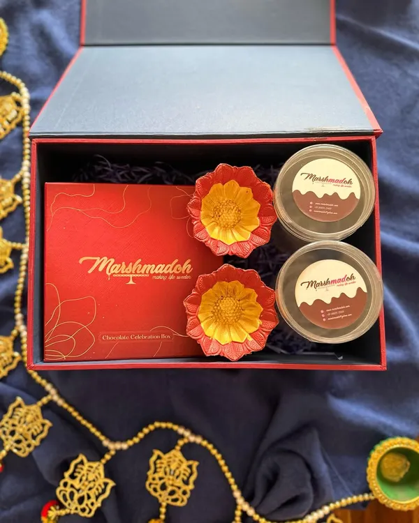 My Diwali gift hampers are designed to make the festival extra special. This box includes homemade, healthy, and guilt-free treats like diya-shaped chocolates and dessert jars.