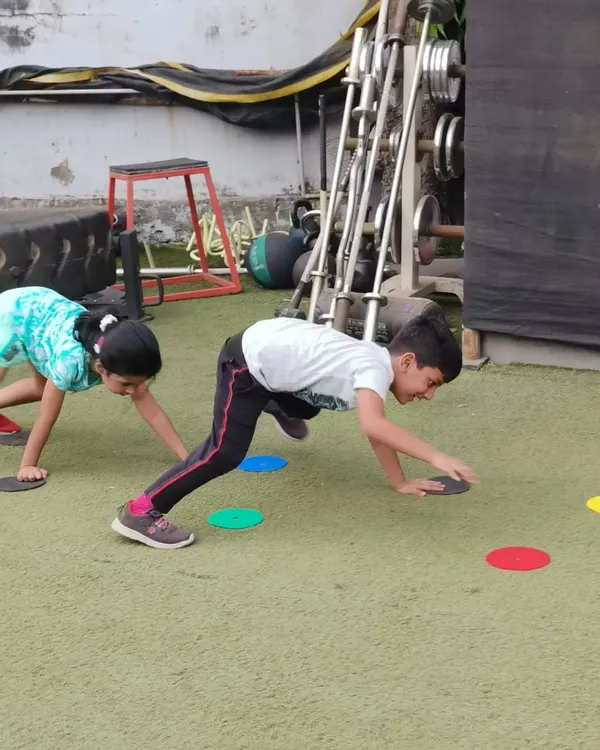 This crawling game is a fantastic full-body workout that improves coordination. The kids are so focused on touching the colored markers that they don't even realize they're building strength and stability.