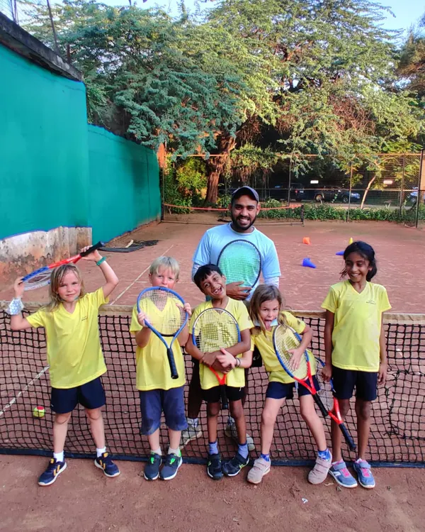 A happy group from my mini tennis program. I use age-appropriate racquets and a fun-first approach to introduce the sport to young children.
