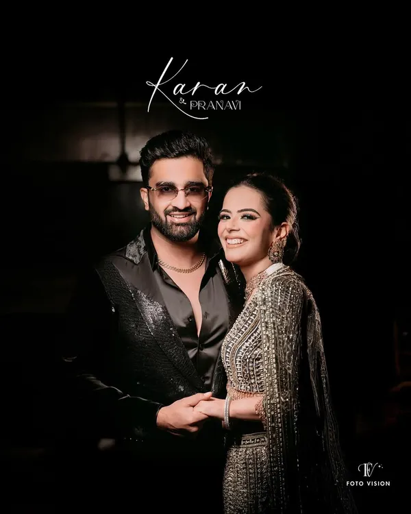 A classic, smiling portrait of the couple at their cocktail night, perfectly capturing the glamour and happiness of the evening.