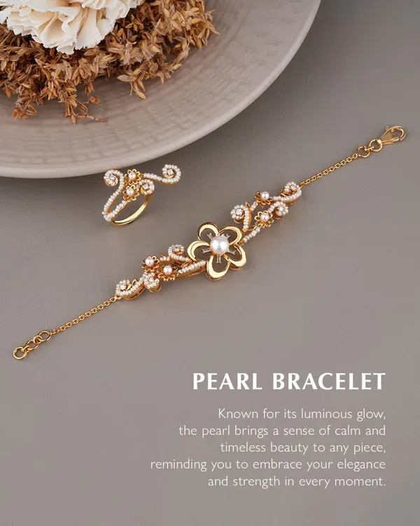 Let every movement shimmer with charm. The pearl, with its calming glow, pairs effortlessly with intricate goldwork in this bracelet and ring set. It is a delicate, romantic, and undeniably elegant design.