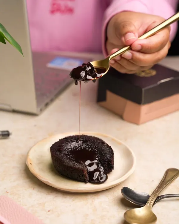 This shot of a molten lava cake was created for a dessert brand's social media. The "work from home" context makes the indulgent treat feel like a well-deserved break.