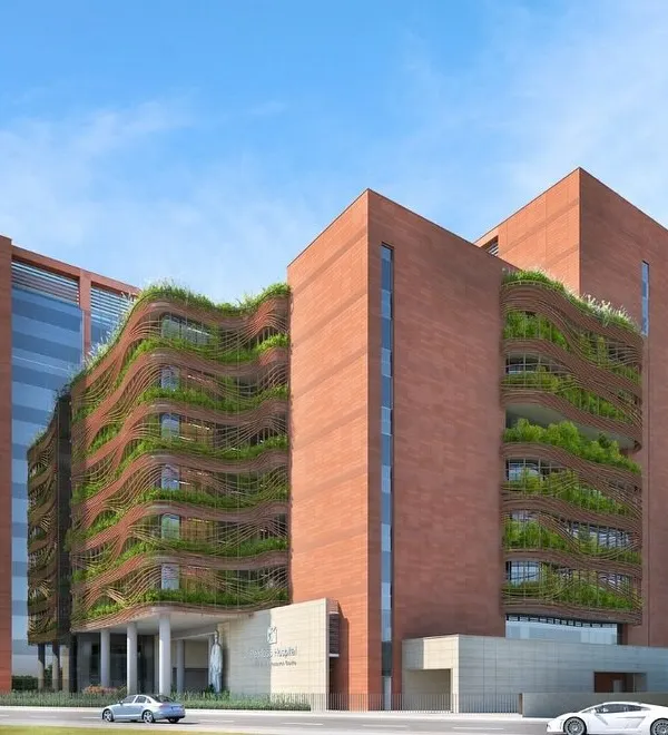 We envision hospitals as ecosystems of healing, where architecture and nature converge. This design for Peerless Hospital in Kolkata features a vertical green skin, creating a biophilic facade that offers visual relief and an improved patient experience, demonstrating our commitment to sensory and human-centric design.