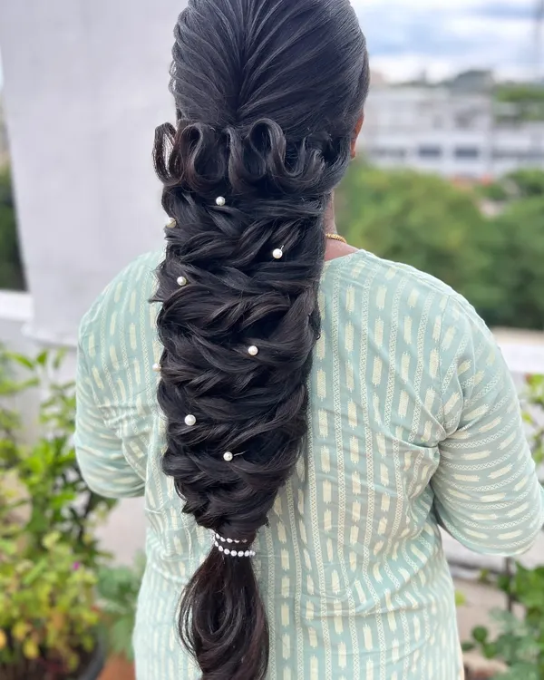 This intricate pull-through braid is a perfect example of the advanced, 'no-crimp' texturizing techniques I teach. The style creates amazing volume and is decorated with simple pearls.