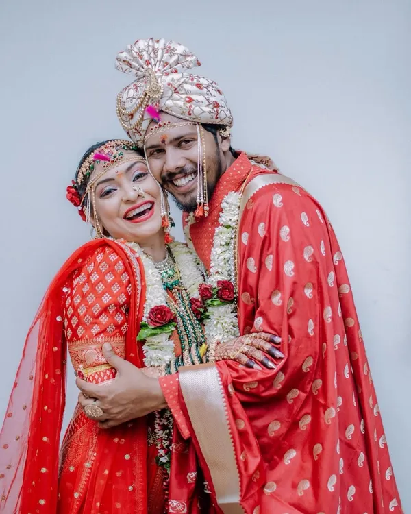 A moment of pure, unscripted joy between the bride and groom. This is the kind of candid happiness I live to capture during a Maharashtrian wedding celebration.