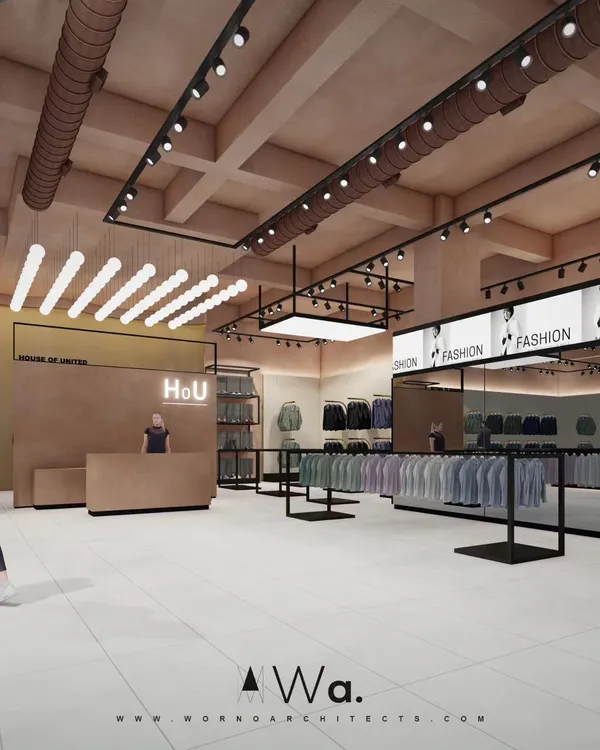 This is a look into an apparel store we designed in Noida, focusing on a raw, industrial aesthetic softened by earthy terracotta tones. The layout uses open display racks and strategic track lighting to create an inviting and modern retail experience.