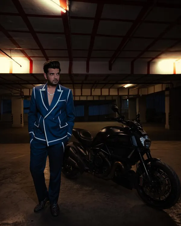 This custom-designed suit was for Karan Kundrra at the Indian Telly Awards. The goal was a sharp, modern look with standout details like the contrast piping, creating a powerful silhouette for the red carpet.