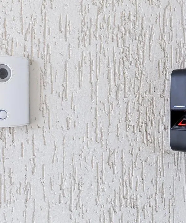 Here is an example of an integrated access solution we installed. It combines an audio-video communication unit with a biometric fingerprint scanner, providing two layers of verification for secure entry.