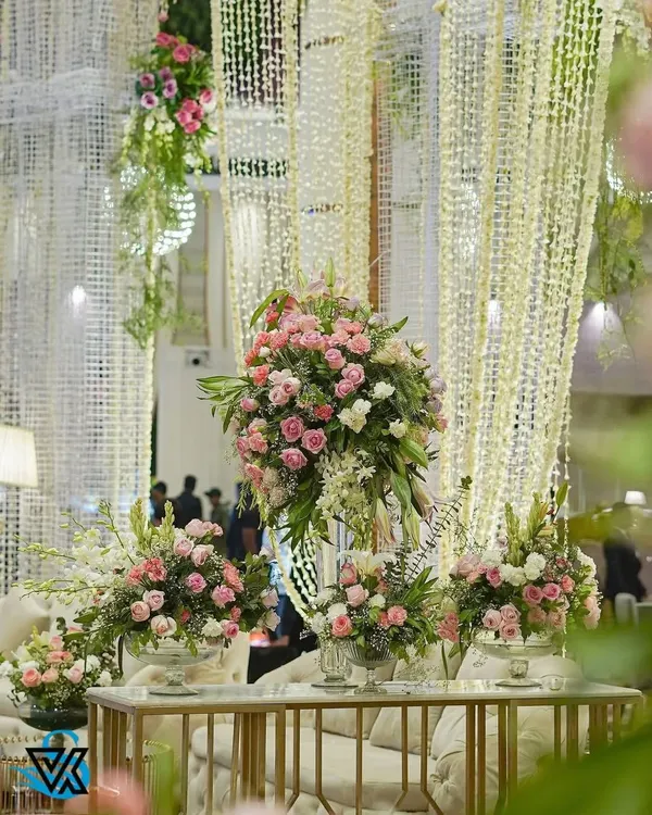 An abundance of pink and white roses creates a feeling of pure romance. We used these lush floral arrangements on guest tables and as statement pieces throughout the venue to build a cohesive and beautiful environment.