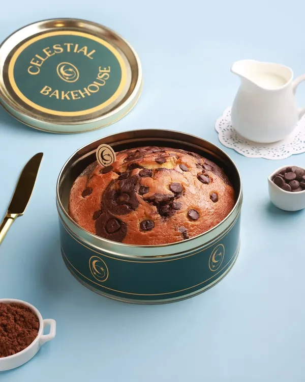 Our Marvel Marble Cake, a perfect swirl of vanilla and chocolate, presented in its travel-friendly tin. It's a simple pleasure, done right.