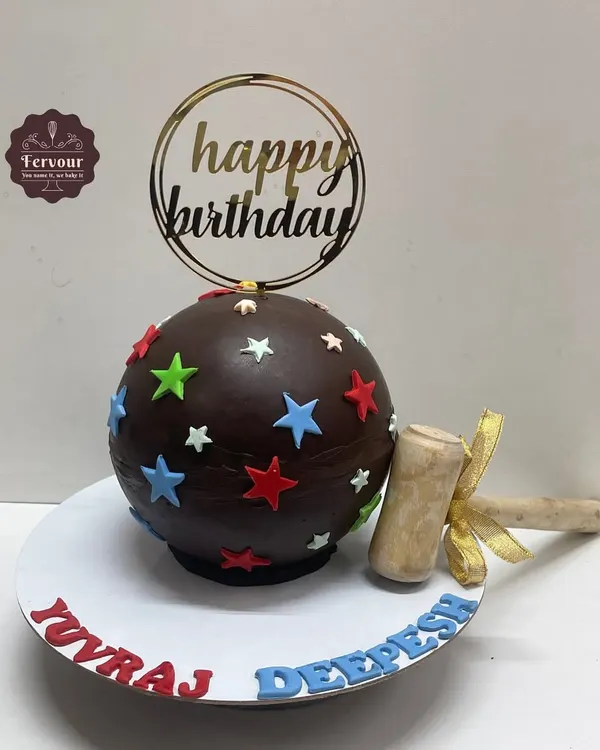 A classic chocolate piñata cake, perfect for any birthday. The chocolate sphere is decorated with colorful stars and comes with a wooden hammer to smash and reveal the goodies hidden inside.