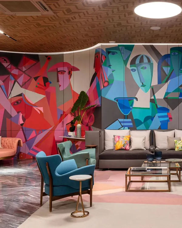 'The ClanDestine House,' a project where we used art to give a home character and color. This mural, a fusion of cubist and abstract styles, brings a dynamic energy to the main lounge area.