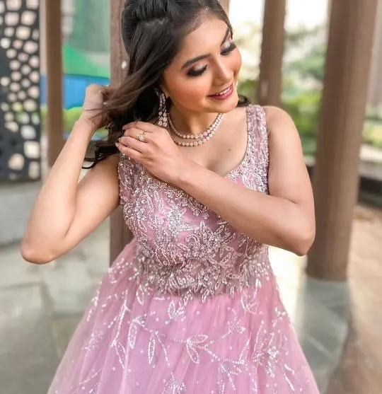 A close-up of the sparkling bodice on this pink gown. The intricate beadwork is designed to make you shine.