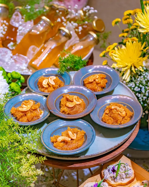 A close-up of a traditional Indian sweet, Moong Dal Halwa, served in small blue bowls as part of our Ganesh Chaturthi festive spread.