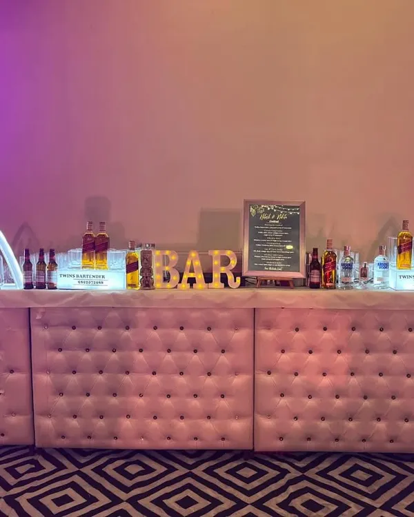 Our most popular setup: the pink tufted LED forming bar. This 16-foot bar is a true centerpiece, with customizable lighting and elegant design, perfect for weddings and grand celebrations.