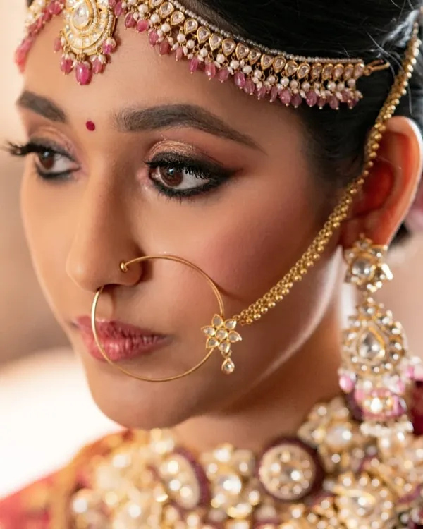 This is the essence of my bridal philosophy: timeless, regal, and absolutely radiant. I focused on creating flawless skin and defining her eyes with a classic winged liner, letting her natural beauty be the centerpiece. This is the kind of look that remains stunning for years to come.