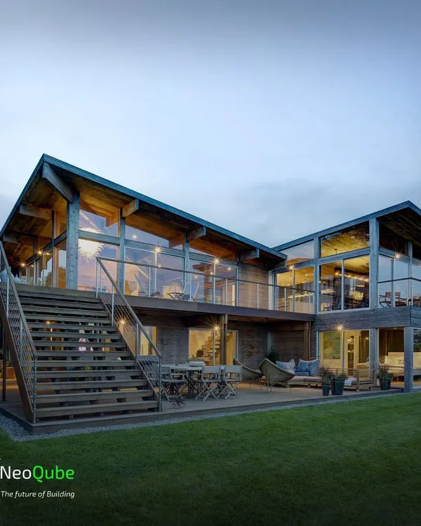 Imagine a luxurious, multi-level prefab home with soaring ceilings and glass walls that frame the landscape. This design concept embodies our vision for modern, sustainable luxury living.