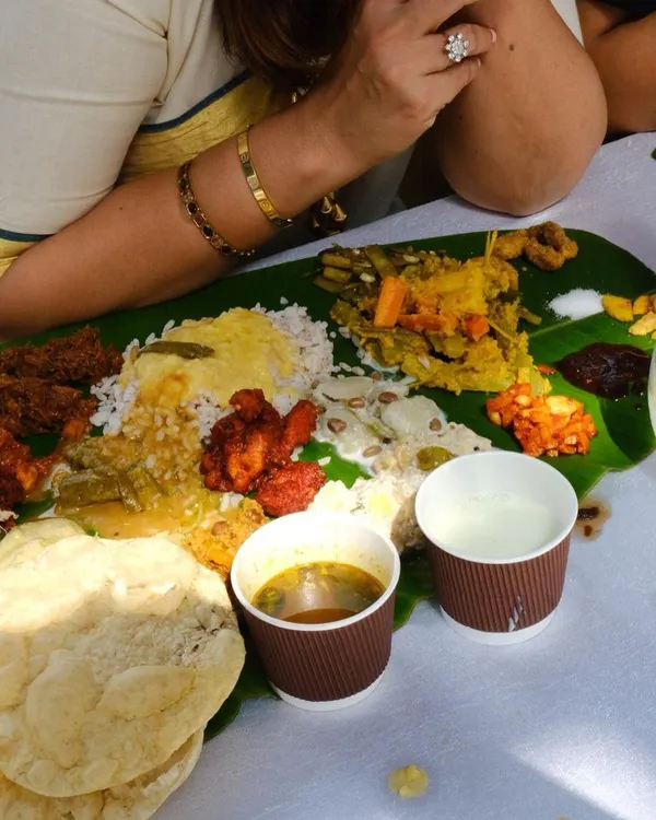 This is what a true feast looks like. A photo from our Onam Sadhya event where we served over 200 people a full traditional meal on a banana leaf. It was a wonderful community gathering filled with great food and company.