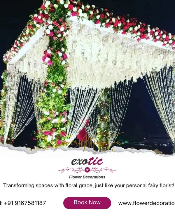 A wedding mandap that feels like a dream. We constructed this stunning structure with pillars of fresh greenery and roses, crowned with a canopy of delicate hanging florals for a truly magical ceremony.