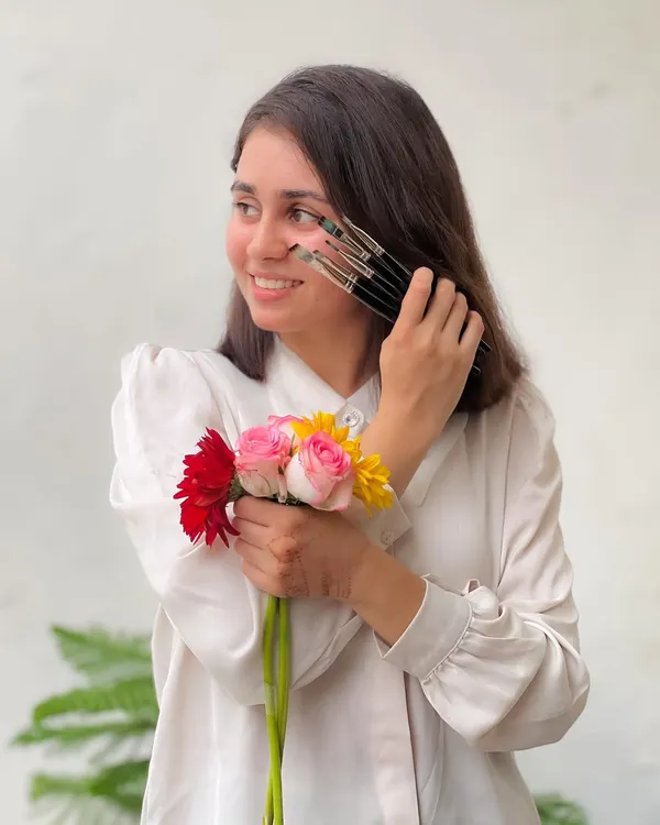 Lost in colors, searching for myself. This is me with the tools of my trade and the flowers that inspire me. Art is not just what I do, it's who I am.