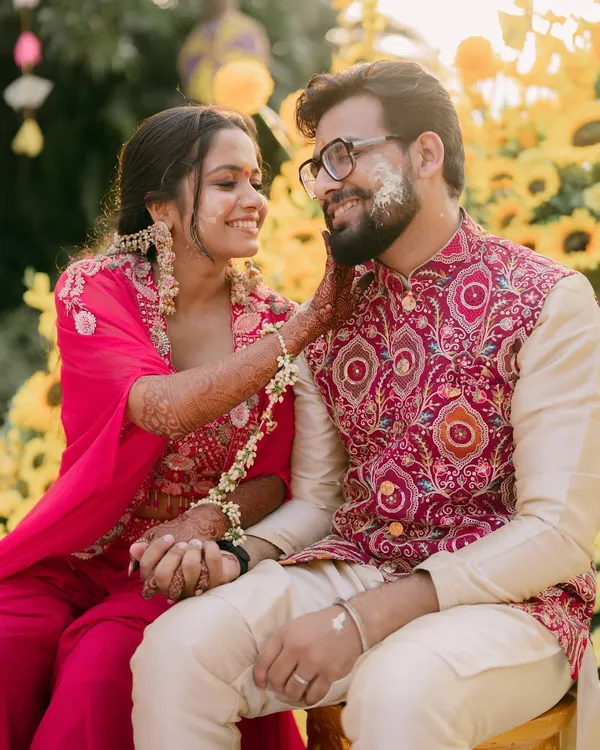 She brought sunshine with her smile, and I added just the right glow to match. This bride owned her haldi moment in style, sharing a playful moment with her groom.
