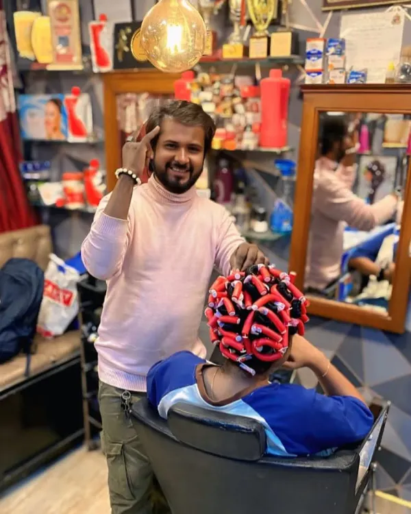 Here I am during the permanent curling process. The hair is carefully wrapped around curling rods before the solution is applied to set the new shape.