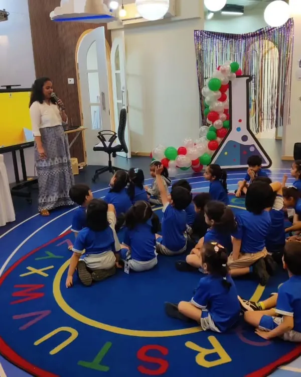 An instructor addresses a classroom of engaged preschoolers. We tailor our workshops to be age-appropriate, capturing the attention of even the youngest learners.