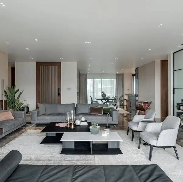 This expansive living room, designed for a young family, is divided into a large social area and an intimate family space. I believe in creating personal sanctuaries that balance timeless design with practical functionality for everyday life.